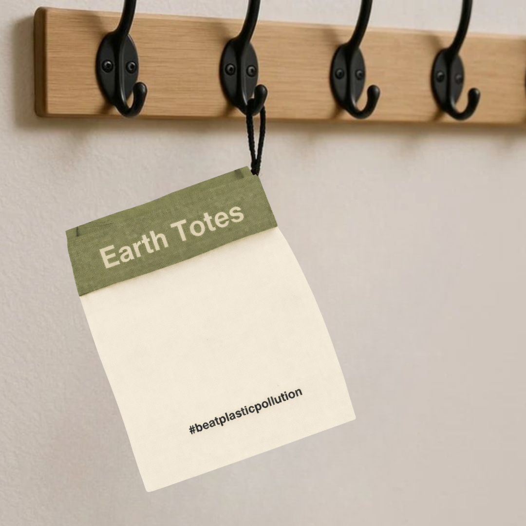 Earth Totes product tag hanging from a wooden hook against a neutral background