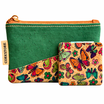 Green cork pouch with a colorful butterfly patterned mirror on a white background